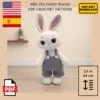 Crocheted bunny with pink-lined ears and gray overalls in a minimalist room. Label says "Albi, the Easter Bunny PDF Crochet Pattern." PDF and flags shown.