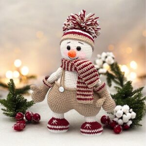 Handmade Crochet Snowman amigurumi with cozy scarf and hat – soft plush Christmas decoration for shelves, mantel, or holiday gift for kids and adults