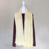 Handmade Cable Knit Off White Scarf draped on a white mannequin torso with a brown top, set against a neutral background, conveying warmth and coziness.